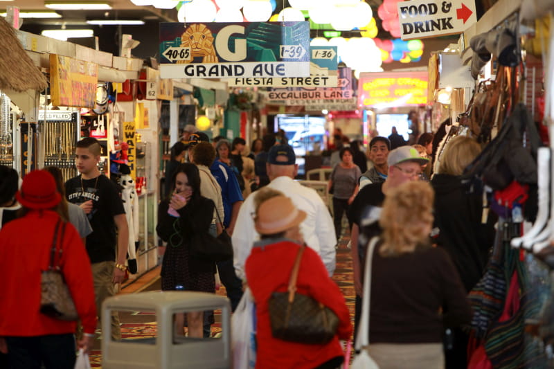Inside Fantastic Indoor Swap Meet — shoppers on Grand Ave